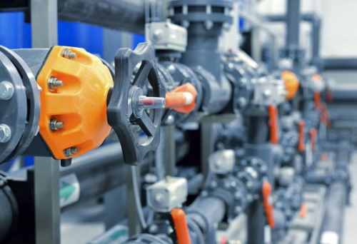 A set of taps and pipes in a commercial building that have had maintenance done to it by Ipswich Plumbers.